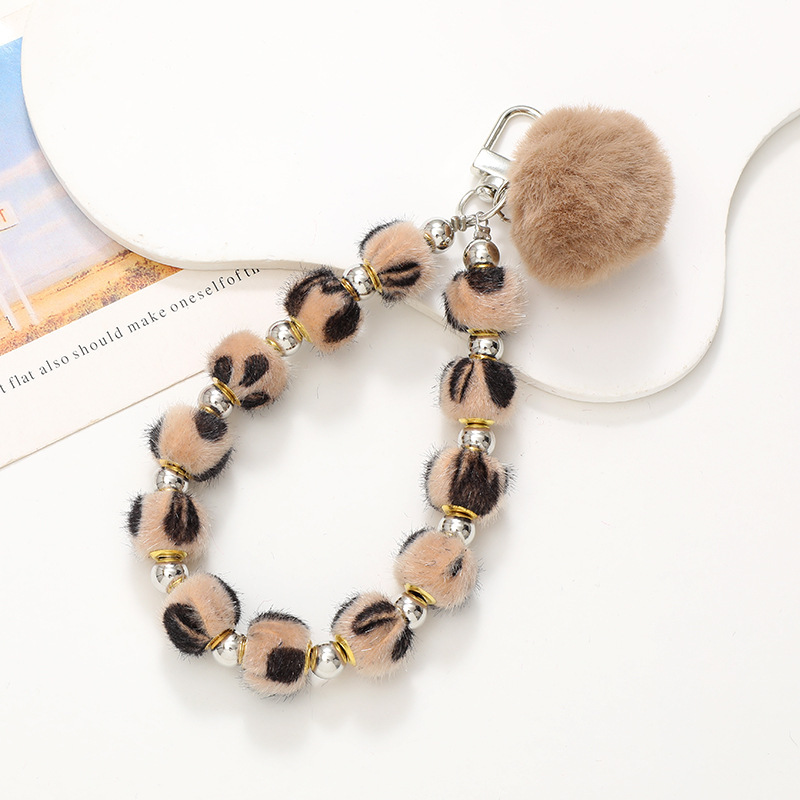 Nuevo Otoño e Invierno de moda ins Bola de piel teléfono móvil colgante teléfono Shell colorido con cuentas de felpa correa de muñeca conveniente correa de mano