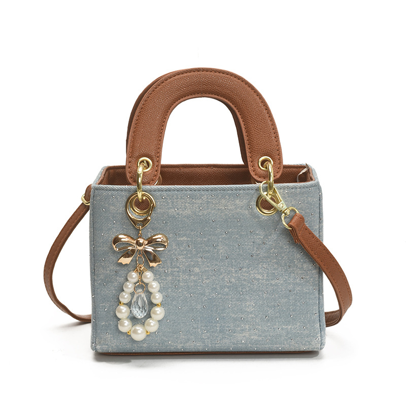 Diseño de nicho color en contraste bolso cuadrado pequeño portátil femenino 2025 nuevo bolso diagonal de diamantes retro de alta gama de moda