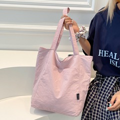 韓国のシンプルな無地のキャンバスバッグ女性用 2025 新しい大容量軽量ショルダートートバッグ多用途通勤バッグ