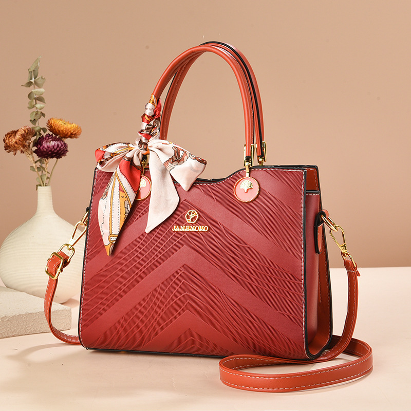 Bolsas de mujer transfronterizas 2025 nueva moda relieve bolsas de mano de gran capacidad bolsas de madres de mediana edad bolsas de hombro mochila
