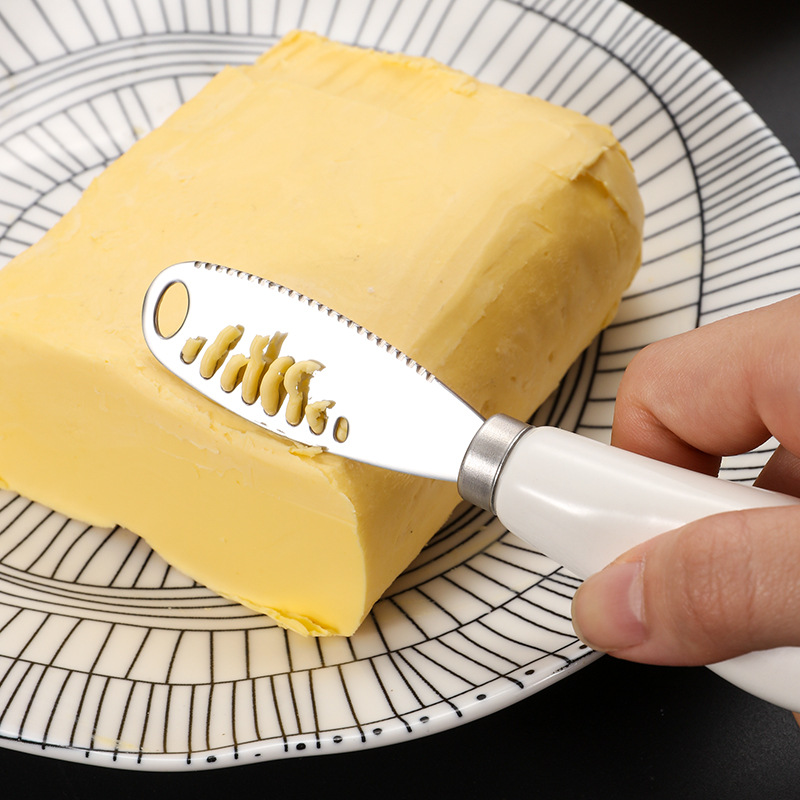 Cuchillo de mantequilla con mango de cerámica 430 Cuchillo de mantequilla de acero inoxidable con agujeros Cuchillo de queso doméstico Cuchillo de mermelada Cuchillo de queso crema