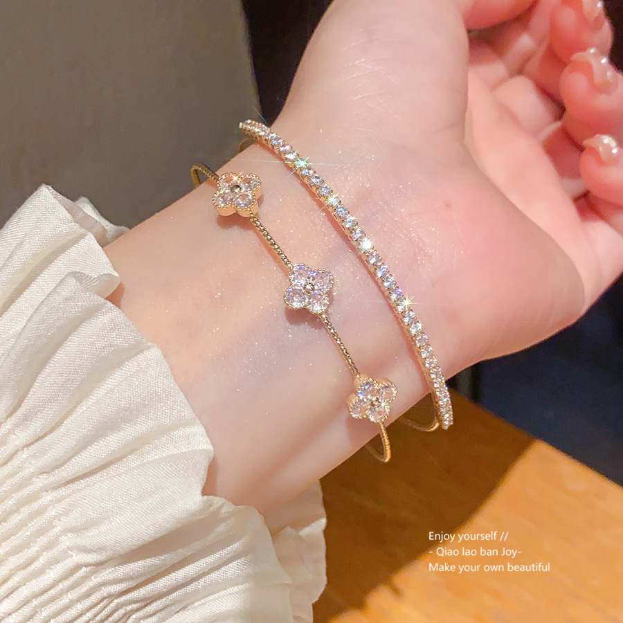 ジルコンの花の十字の二重の開口の腕輪の軽くて豪華な高級感の手環のファッションのinsの百合の手飾りの卸売り