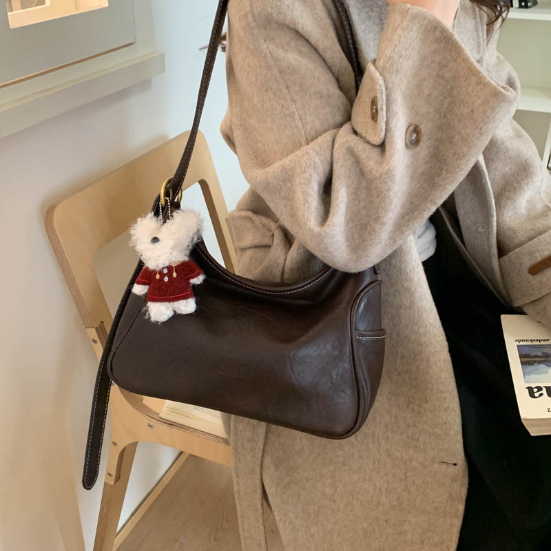 Coreano de cuero suave de alto nivel de hombro bolso de brazo para mujeres 2025 nueva bolsa de transporte de viaje bolsa casual versátil mochila