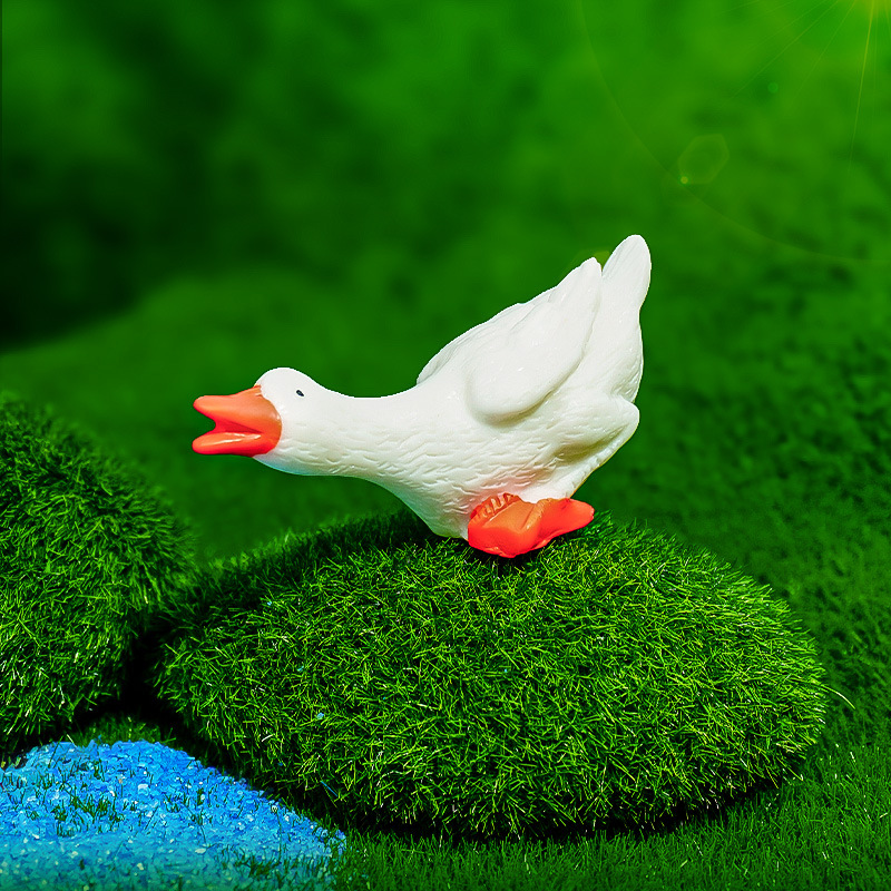 Recomendar resina blanca canto fluorescente ganso blanco pequeños adornos ornamentos de paisajismo de acuario agua potable pato venta caliente