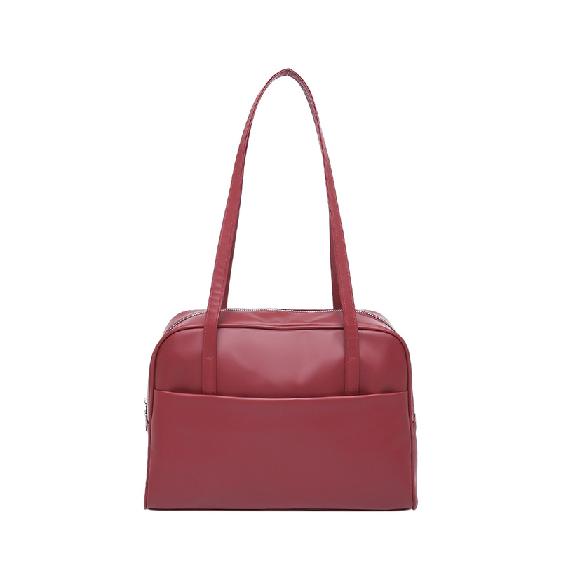 Bolso de hombro coreano de gran capacidad para mujeres 2025 primavera nuevo bolso de brazo retro estilo extranjero bolso de viento minimalista