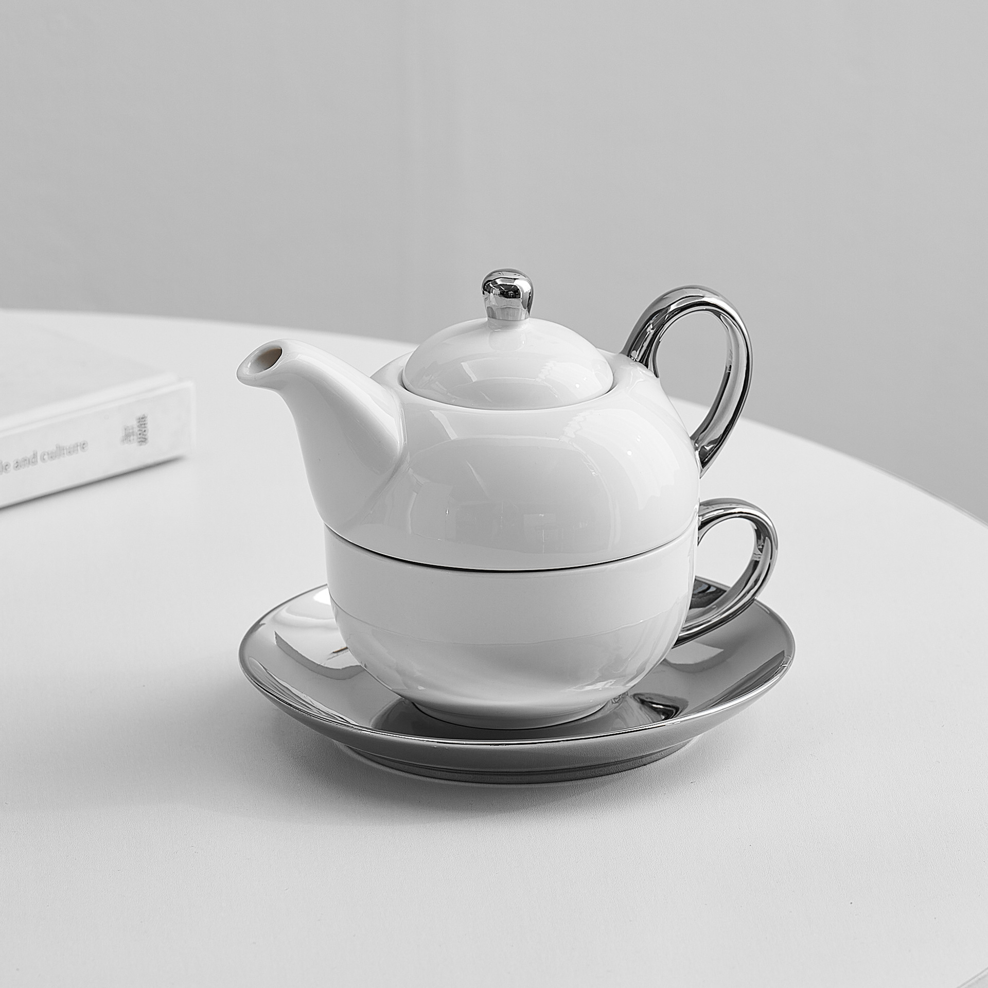 Tetera transfronteriza con logotipo, juego de té de cerámica, té de la tarde, taza de café, tetera, olla de lujo ligera