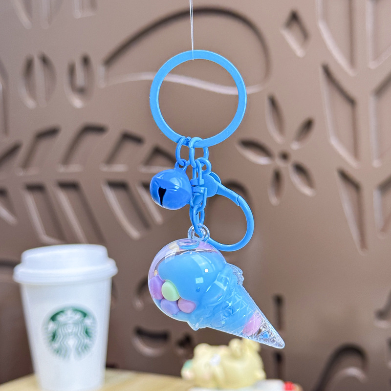 Caricatura en aceite líquido arena flotante botella mochila llavero delicado colgante accesorios accesorios máquina de muñecas pequeños regalos al por mayor