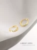 Golden earrings with pigtail