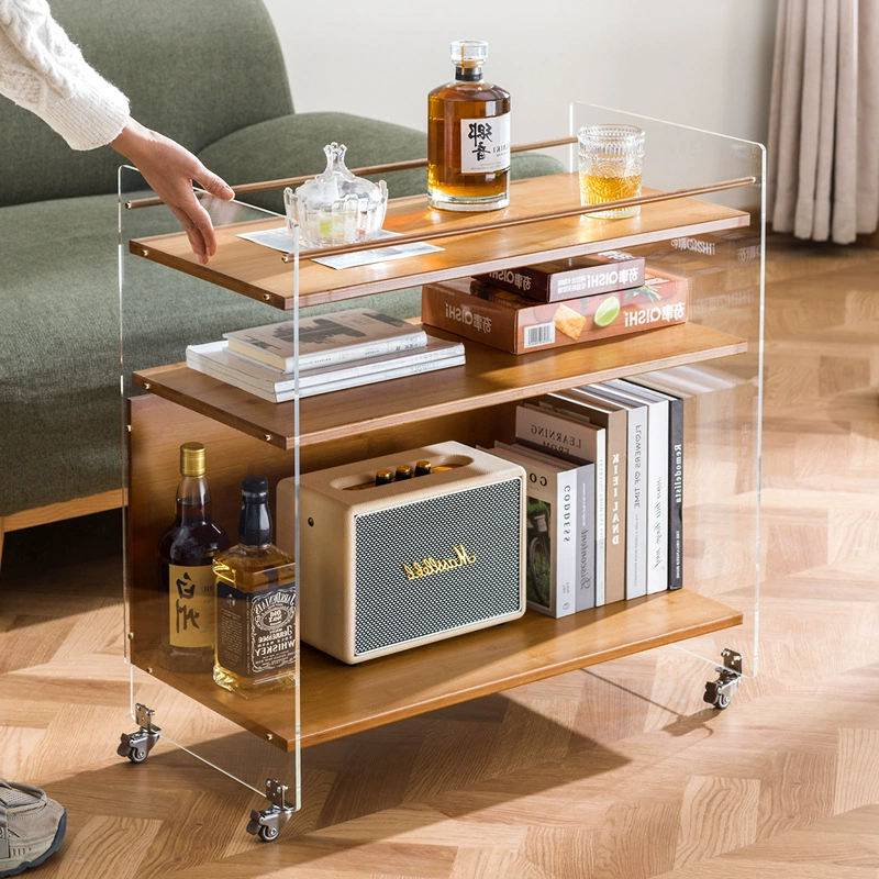 Съемный диван рядом с маленькой тележкой креативный журнальный столик для гостиной