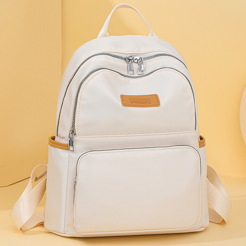 2024 nueva mochila de nylon para mujer, bolso de tela de todo fósforo de estilo coreano de moda, mochila pequeña para madre de viaje de ocio ligero