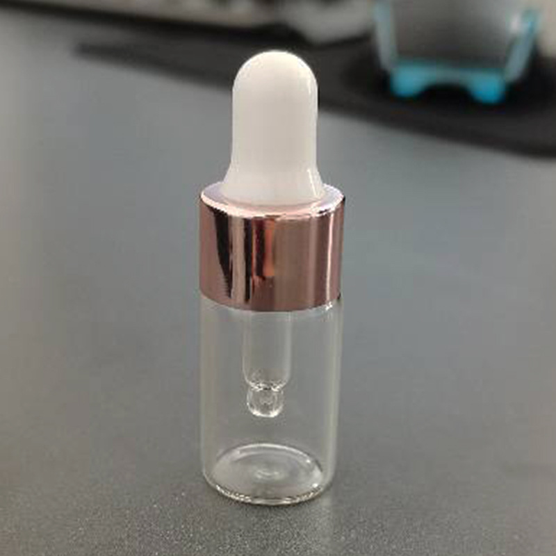 1ml una pieza 3528; botella transparente con anillo de oro rosa; vidrio