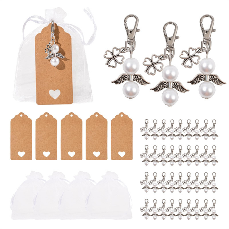 Venta caliente transfronteriza Llavero Trébol de cuatro hojas Estilo de moda etiqueta de regalo de mano Juego de caja de regalo de fiesta de boda