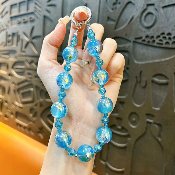 Blue starry sky, beaded bracelet, mobile phone, gradient