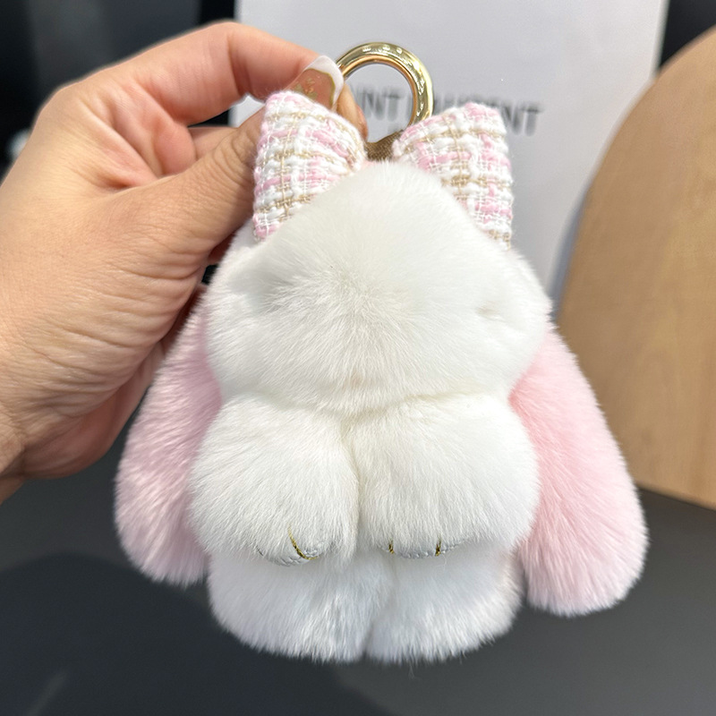 卸売りのかわいいウサギの毛の蝶結びの小さいウサギの自動車のキーホルダーはぬいぐるみのかばんを掛けて飾ります。