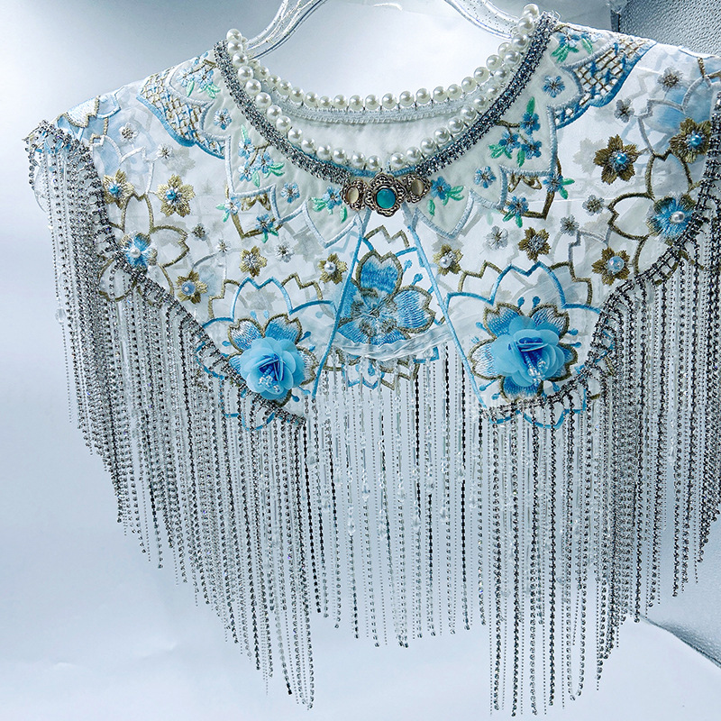 Luxurious Blue Gown with Intricate Shoulder Design, Exquisite Diamond Strips, Tassels, Pearls, and a Faux Collar