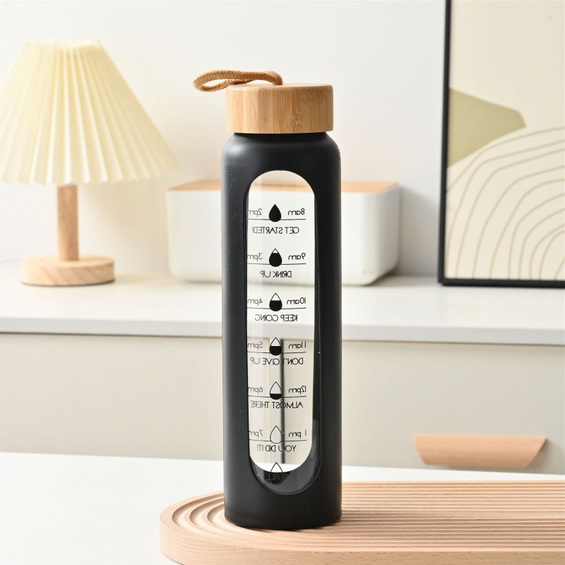 Taza de vidrio con tapa de bambú de gran capacidad transfronteriza, cuerda de elevación, cubierta de silicona portátil, taza de agua graduada, botella de agua deportiva de vidrio de alto valor