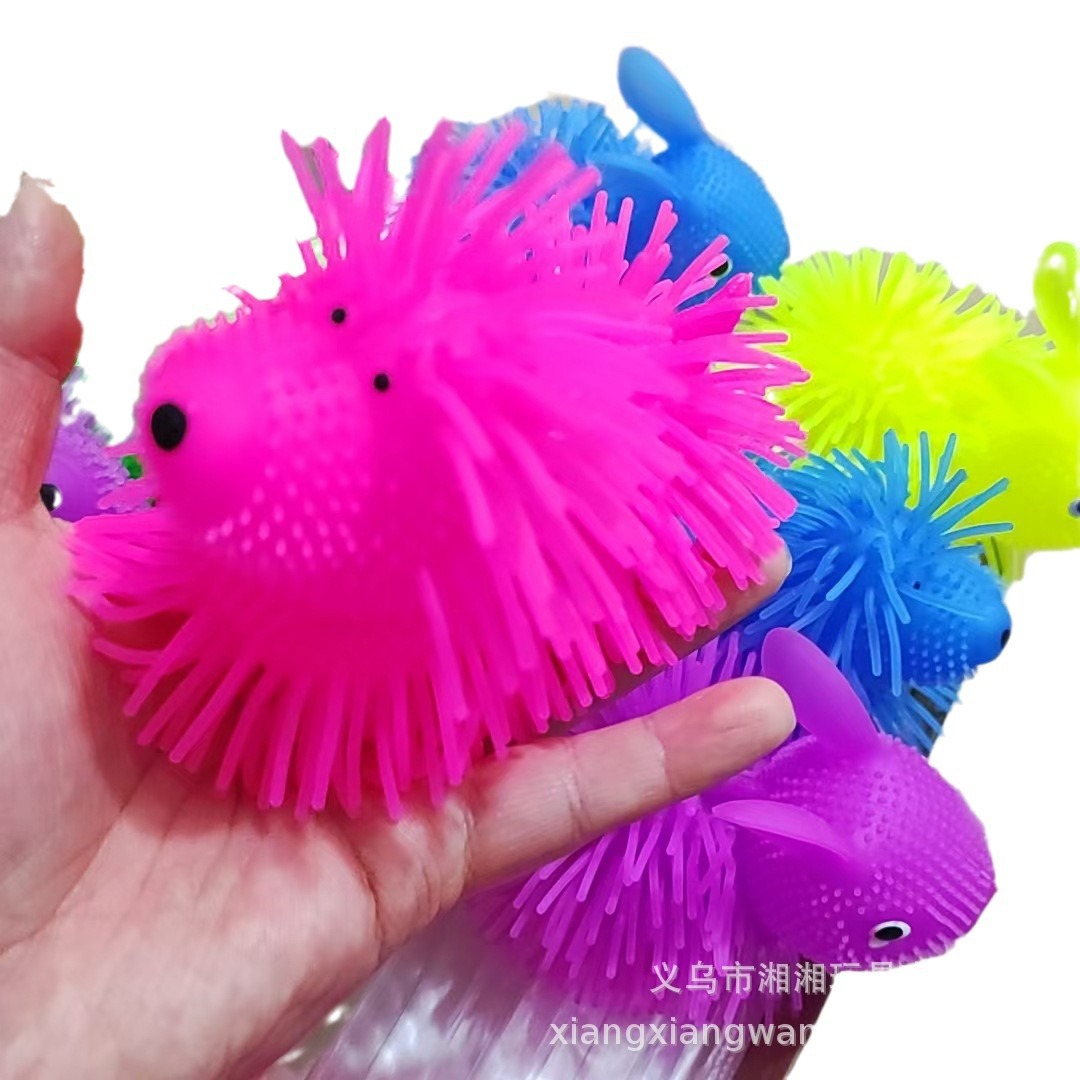 Conejo parpadeante bola de pelo TPR lindos perros peludos brillantes bola de pelo juguetes de ventilación juguetes calientes