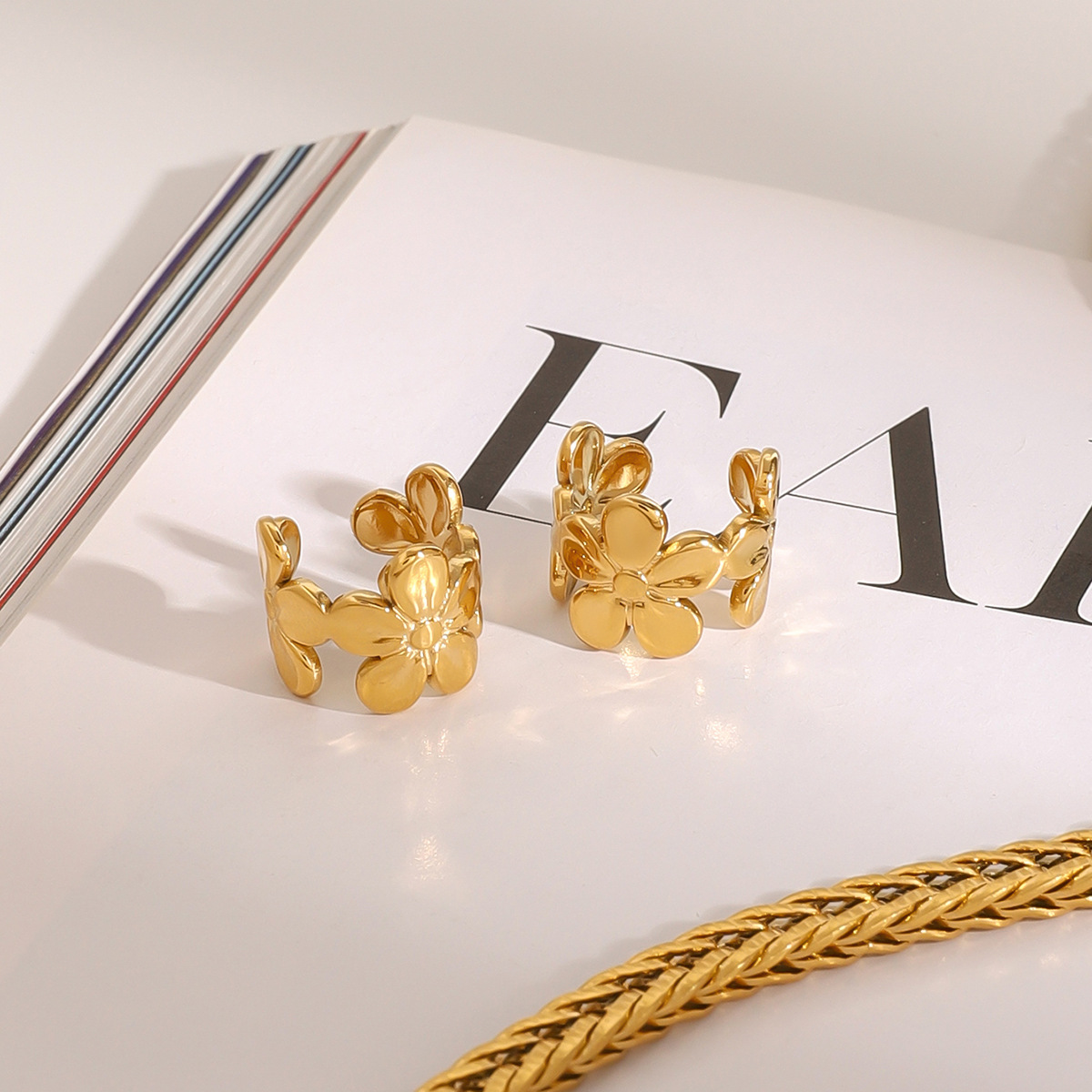 JEDING Europa y América, pendientes de flores de acero inoxidable, pendientes de acero sin agujeros de orejas, pendientes transfronterizos.