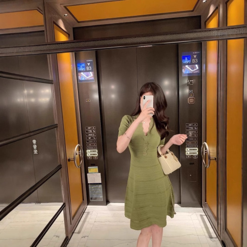 Elegant Sheath Hollowed-Out Ice Silk Dress for 2025 Summer: Wavy V-Neck, Slimming, and Body-Sculpting Knitted Skirt for Women