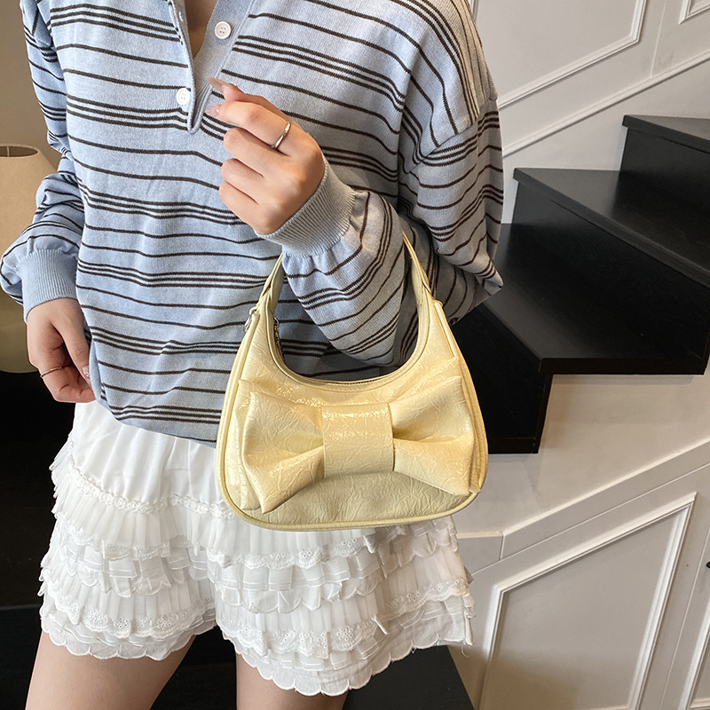 Bolso de moda coreano 2025 verano nuevo bolso femenino de alta calidad textura bolso de hombro lindo lazo bolso de mensajero