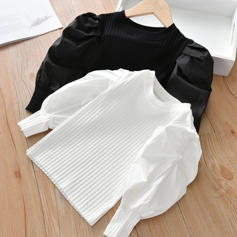 女の子の泡の袖の底のシャツの2025春秋は新型の子供の小さい子供の洋風の長袖のtシャツの韓国版の上着を詰めます。