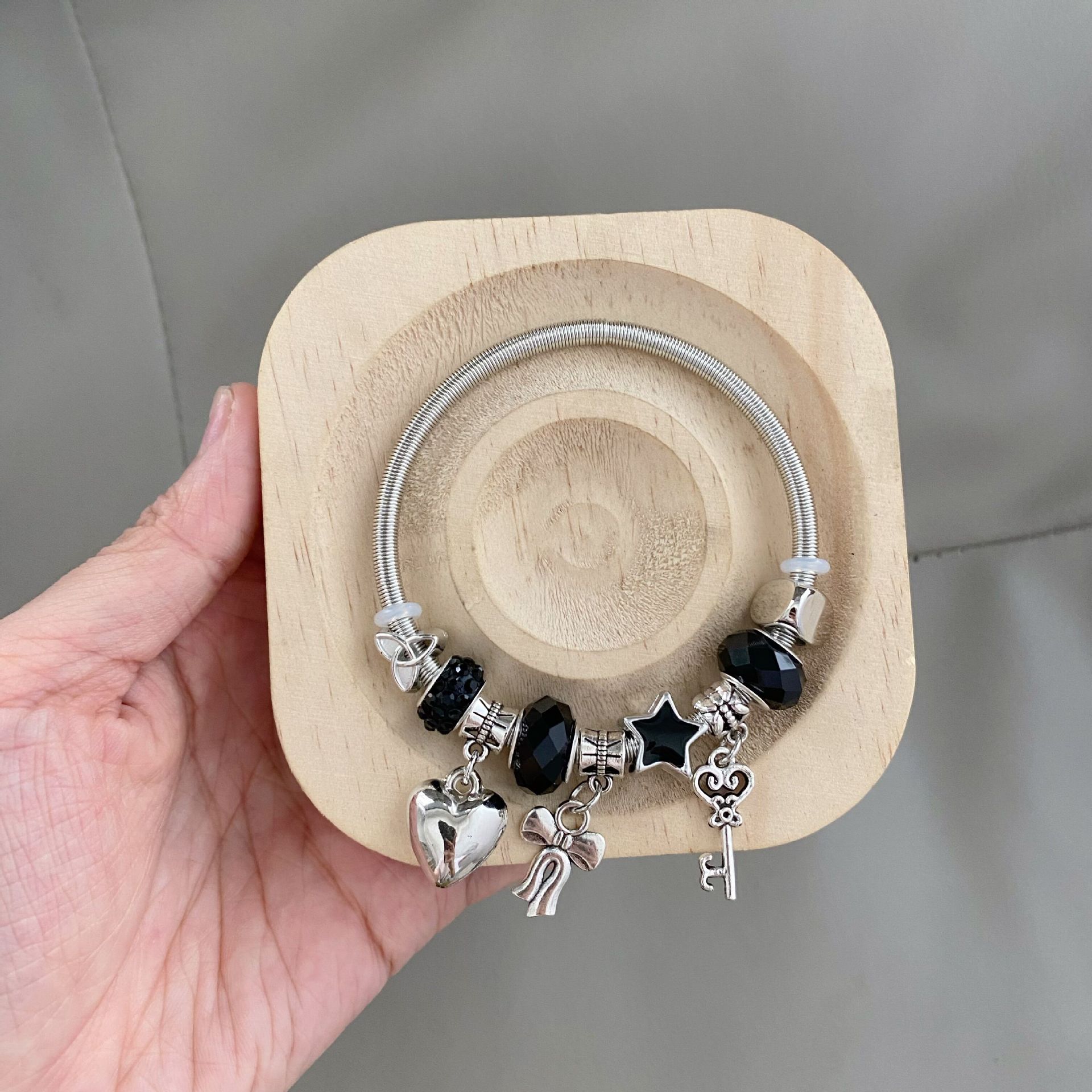 Millennium black bow bracelet