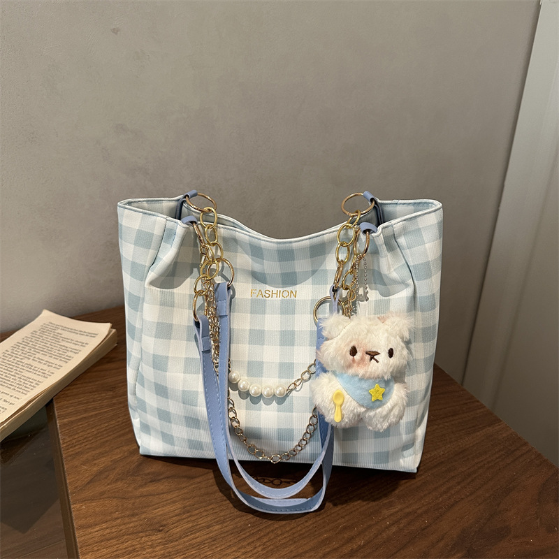 Bolsa de alto valor reticular para mujeres 2026 primavera y verano nuevo paquete de viaje de hombro universal bolso de nicho en línea bolsa de mujer