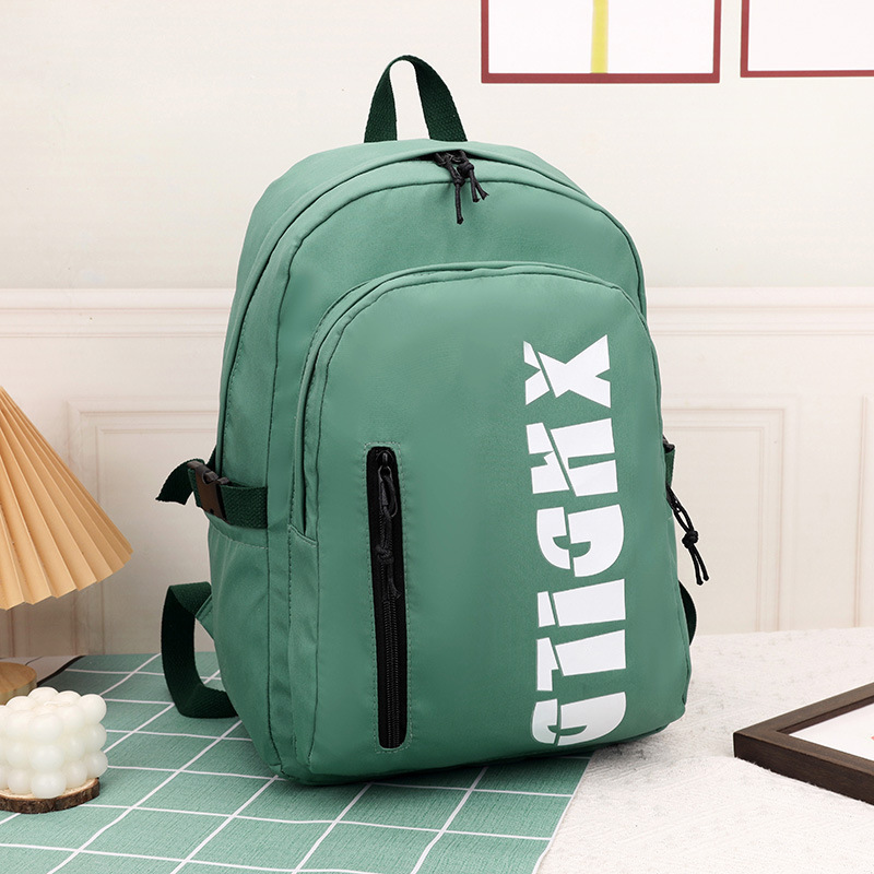 Mochila de moda de moda para hombres 2023 nueva mochila de hombro femenina de gran capacidad de letras de escuela secundaria mochila escolar