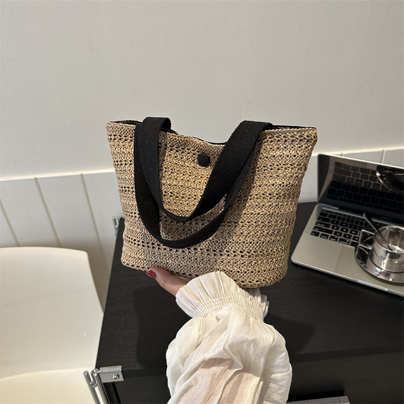 Paja tejida de gran capacidad temperamento bolsas de mano de verano 2024 nueva bolsa de ocio de estilo extranjero este año popular bolsas de cubo de hombro