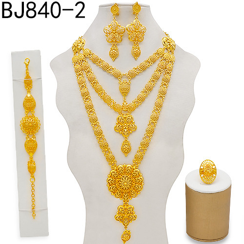 Elegant European and American cross-border exaggerated gold-plated necklace set with earrings, bracelets, and rings embedded with water diamonds.