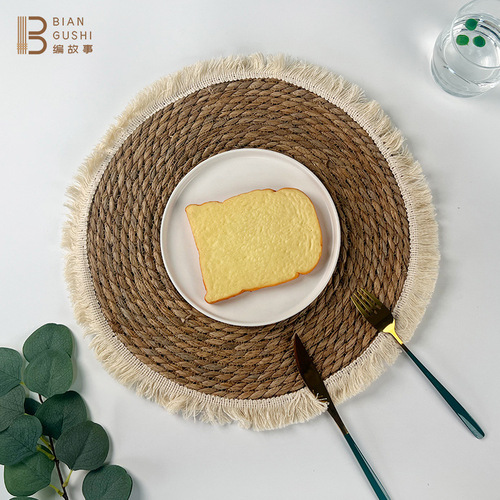 Cross-border tassel edge rush woven round grass placemats, photo props, heat insulation anti-scald mats, table mats, cup mats