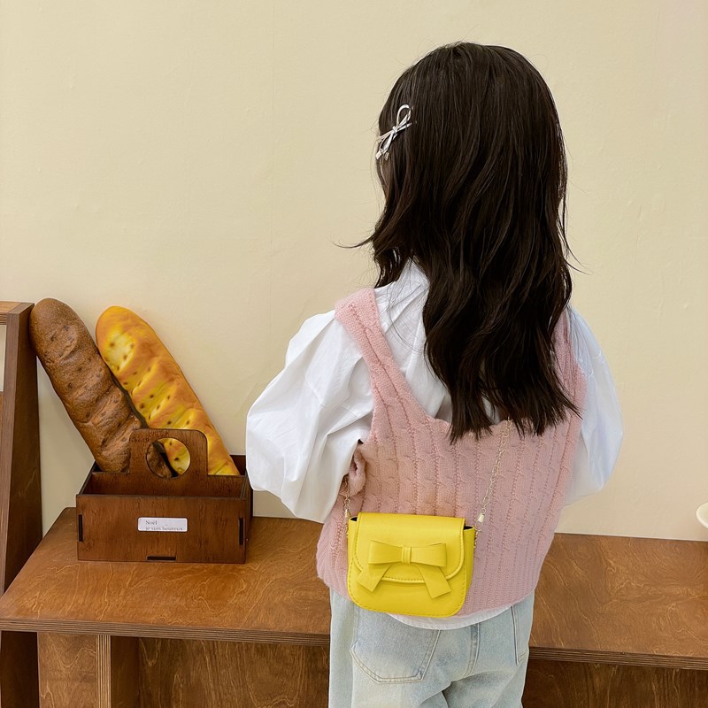 Bolsos de hombro de princesa de color sólido mini lindos bolsos de arco para niñas 2025 nuevos bolsos de cadenas para niños