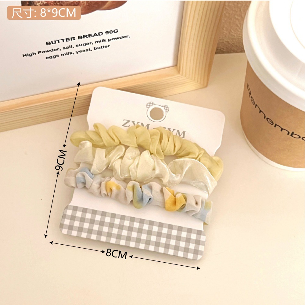 Primavera y verano dulce anillo de cabello conjunto de cuerda de cabello pequeño dulces frescos adornos de cabello de color de la niñez de banda de goma universal toque