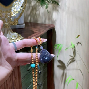 Hetian jade smoke purple Buddha, mysterious and solemn unique smoke purple color, such as smoke.