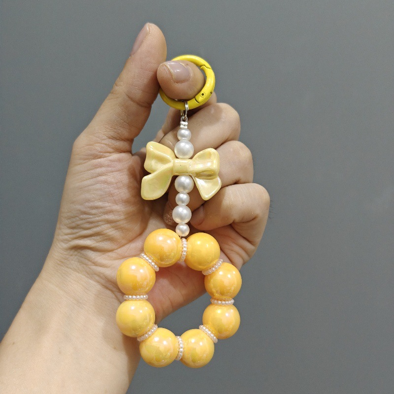 Nueva electrochapado cuentas arco llavero del coche colgante lindo caramelo color pintura anillo de perlas accesorios bolsa Decoración