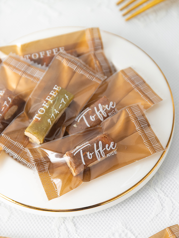 Bolsa de toffee de almendras de sal de mar gruesa independiente Tauragnut único caramelo de café sellado de máquina Año Nuevo 2025