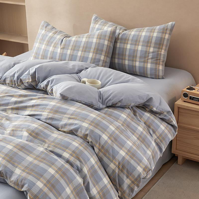 Nuevo traje de cama de algodón lavado de algodón de cuatro piezas de algodón 2025 nuevo traje de dormitorio de funda de edredón de sábana simple de tres piezas