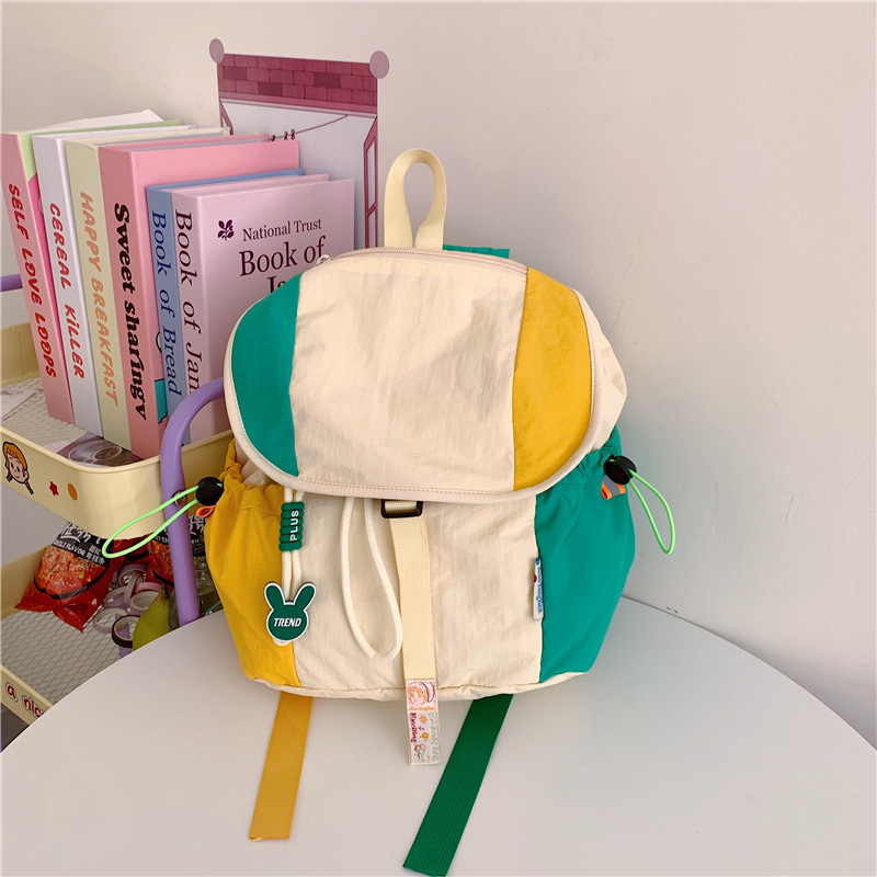 Color contrastante empalme mochila escolar de estudiantes universitarios dopamina suave mochila de niñas con cuerda flip-up mochila de viaje de gran capacidad