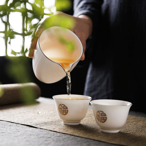 Mutton fat jade white porcelain fair cup tea leakage integrated household tea divider ceramic tea set single tea sea cup filter