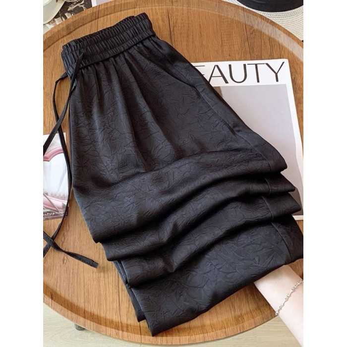 Nuevos pantalones de piernas anchas acéticas de estilo nacional brillo transpirable para mujeres 2025 nuevos pantalones de sandallas delgados impresión de seda de hielo satén