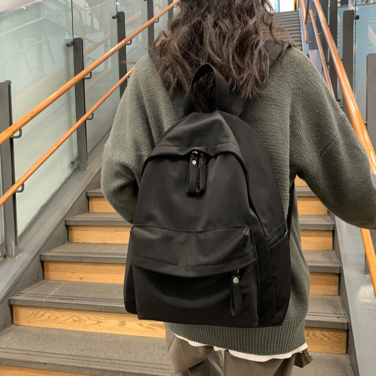 Mochila fabricante spot tendencia pareja de hombres y mujeres con el mismo estilo mochila escolar pequeña fresca de color sólido mochila de algodón de seda fresca para estudiantes