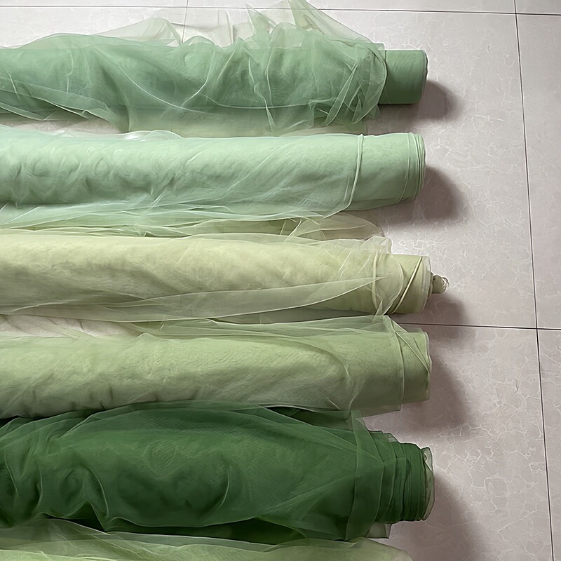 Sheer curtain in avocado green and light green for kindergarten design background and environmental decoration material, soft and dense mesh fabric