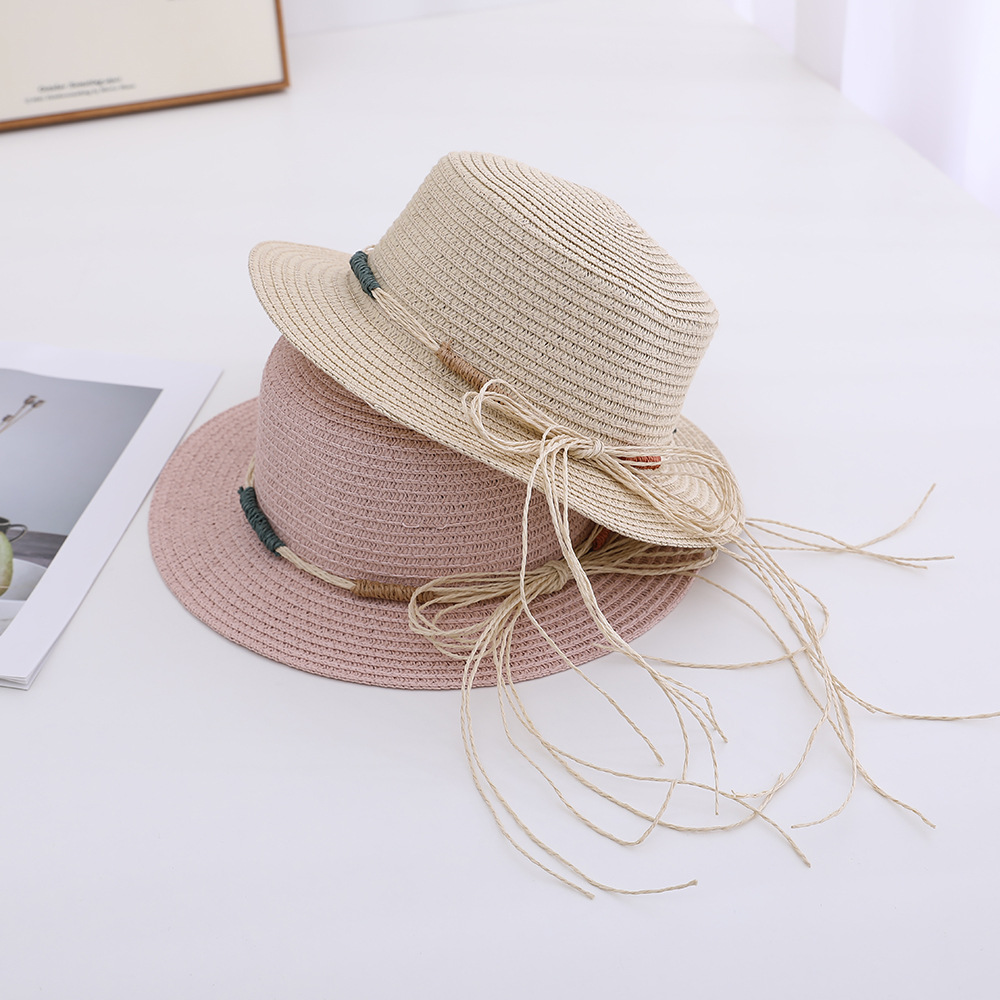 Versión coreana del nuevo sombrero femenino primavera y verano gran ala sombrero para el sol sombrero para el sol de vacaciones protector solar al aire libre sombrero de paja ajustable al por mayor