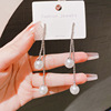 Small design long sophisticated earrings with tassels from pearl, trend of season, wholesale