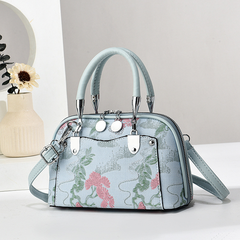 Fabricantes de bolsos de mujer bolsos de mano atmósfera textura bolsos de hombro de gran capacidad bolsos de mochilas bolsos de comercio exterior