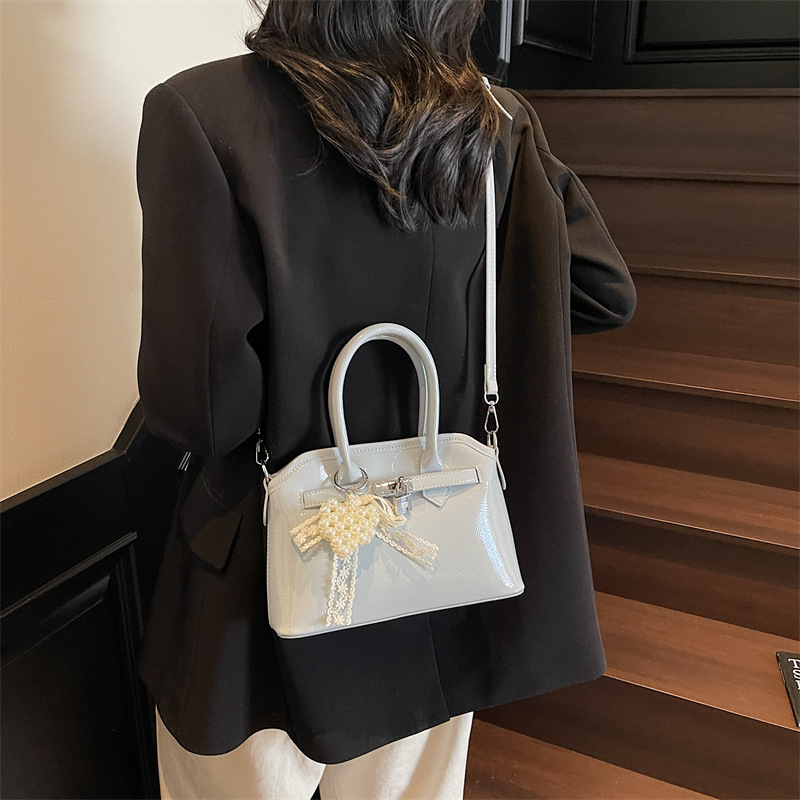 Bolso de concha de moda de verano transfronterizo para mujer 2025 nuevo bolso de hombro de estilo occidental de todo fósforo bolso de mensajero de moda de alta gama