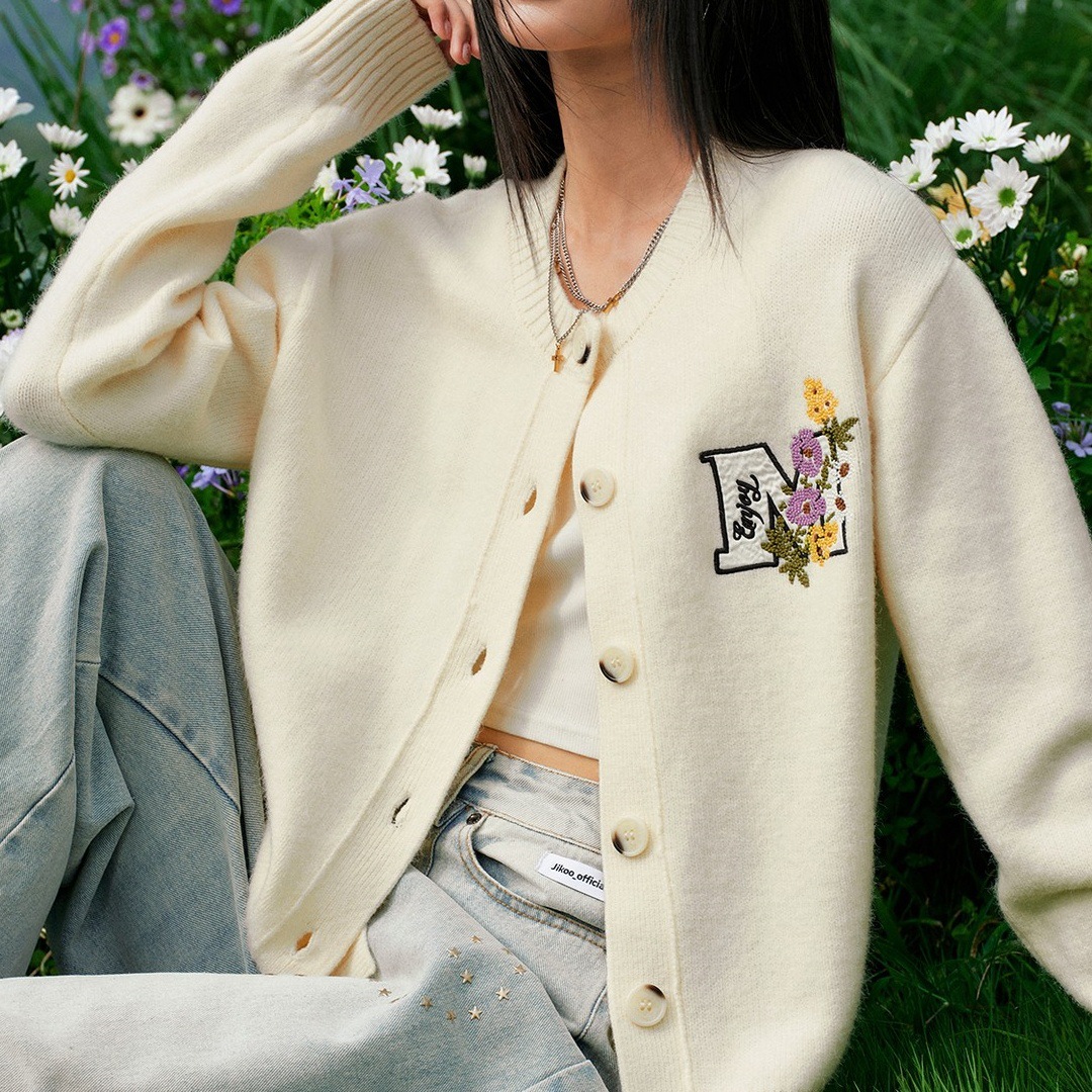 Autumn knitted cardigan with a round collar
