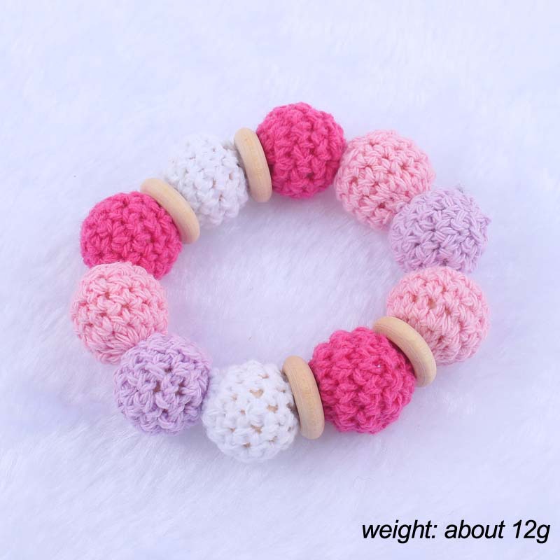 Nueva historieta del bebé haya amor mordedor juguete DIY macaron gran bola de lana mordedura pulsera