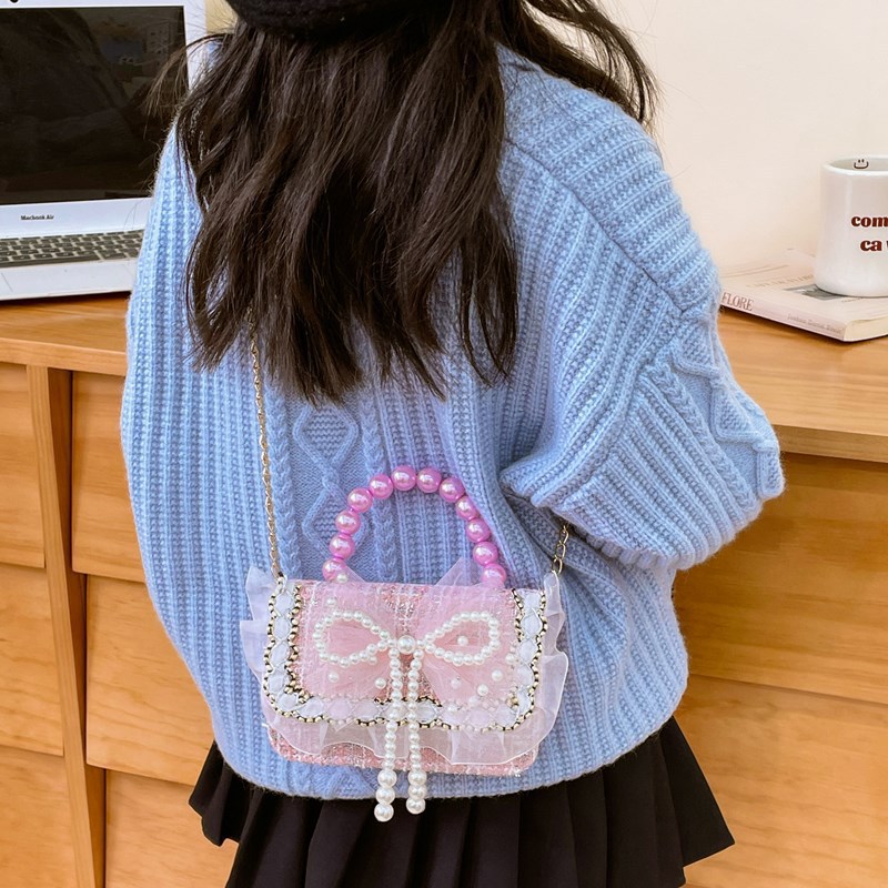 Niña tween pequeña bolsa de hombro arco encantadora princesa mochila de perlas de aire extranjero para niños bolsos lotes