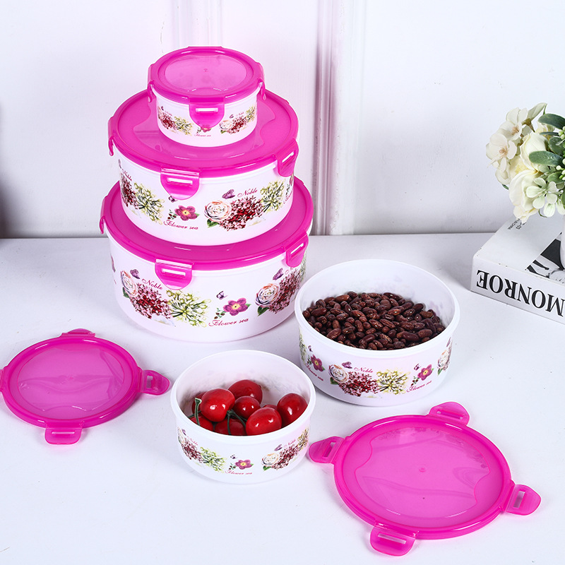 Caja redonda hermética para almacenamiento de alimentos, ideal para refrigerador, camping o uso doméstico.